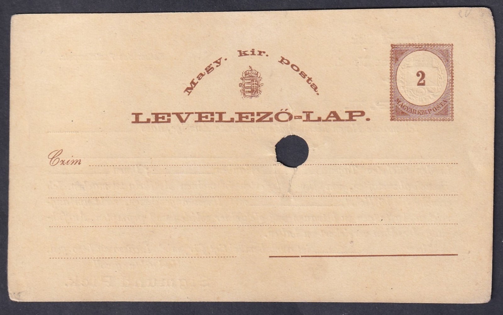 1874. 2 kr levelezőlap, előrenyomott céges nyomtatványként érvénytelenítő lyukasztással