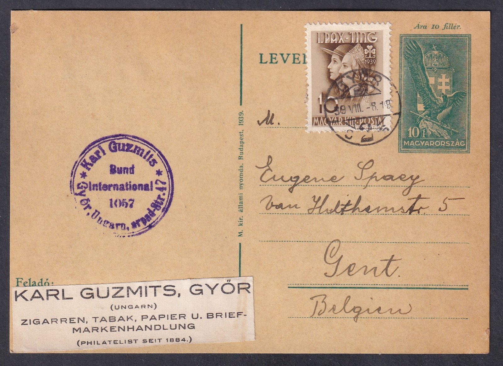 1939. Győr, Belgiumba (Gent)-be feladott levelezőlap - 10 fillér „Cserkész” bélyeggel díjkiegészítve - a lapon Karl Guzmits (Győr) kereskedő reklámbélyegzője tés „Zigarren, Tabak, Papier u. Briefmarkenhandlung – Philatelist seit 1884.” reklám címke